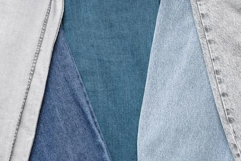 Denim fabric texture background with various shades of blue and gray jeans ma Photos