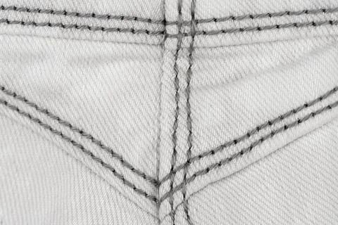 Denim fabric texture with gray stitching pattern top view 스톡 사진