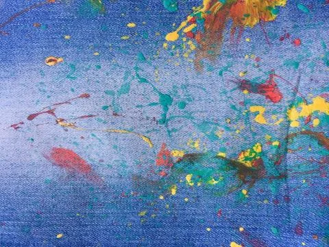 Denim, jeans texture background. Drops of colorful paint on blue background d Stock Illustration