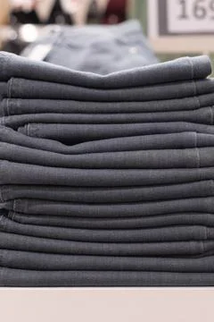 A Denim pants, a stack of blue jeans Stock Photos