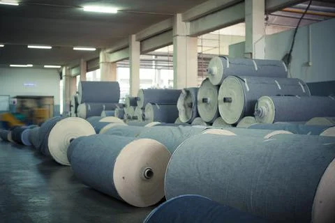 Denim Textile Industry  Ready to Dispatch Jeans Fabric Spools Stock Photos