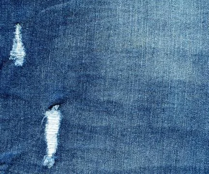 Denim texture, torn jeans Stock Photos