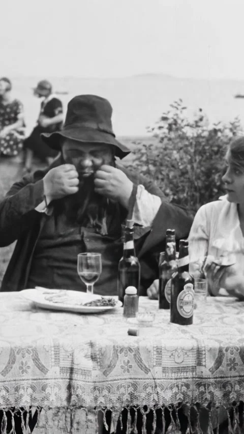DENMARK - 1923 - in this silent comedy, a man has lunch with three younger Stock Footage 339510900