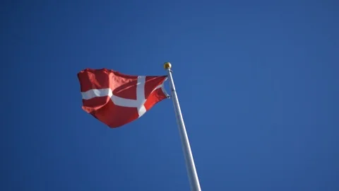 Denmark Flag blowing against clear blue sky background Stock Footage 116039528