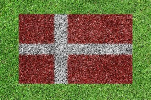 Denmark flag as a paining on green grass Stock Illustration