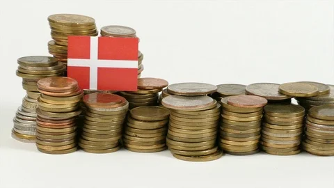 Denmark flag waving with stack of money coins Video stock 71864010