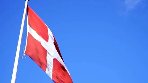 Denmark flag waving on wind  with clear blue sky background. Video stock 99877532