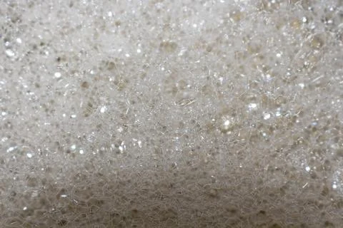 A dense accumulation of small transparent bubbles with light reflections Фото
