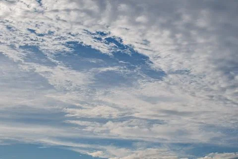 Dense Altocumulus Cloud Layer With Blue Sky Break Overhead Stock Photos