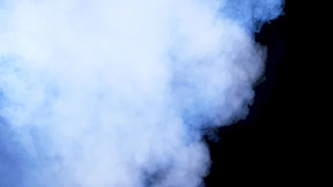 Dense and dynamic smoke clouds over a black background Stock Footage 96415993