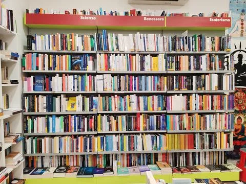 A dense array of books of various genres, in a bookstore Foto stock