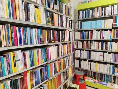 A dense array of books of various genres, in a bookstore Stock Photos