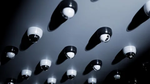A dense array of surveillance cameras continuously loops the footage. Video stock 336042979