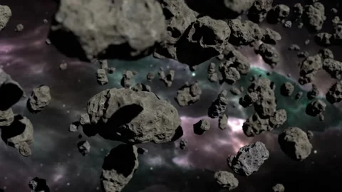 Dense asteroid field floating in deep space with colorful nebula background Stock Footage 317838345