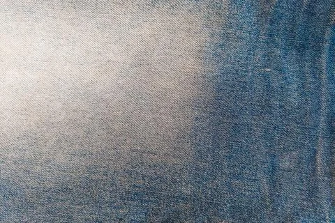 A dense background backdrop texture of indigo blue cotton denim jeans fabri.. Stock Photos
