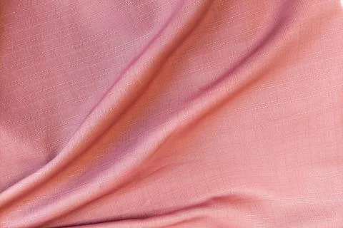 A dense background backdrop texture of smooth light purple lilac satin silk.. Stock Photos