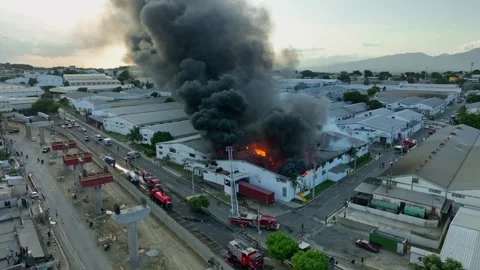 Dense black smoke billowing from a burning area, showcasing the intensity Stock Footage 282973742
