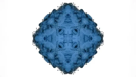 Dense blue ink expands into a mirrored bloom with soft smoky texture Stock Footage 338104898