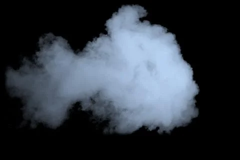Dense bluish-white smoke cloud is billowing across solid black background in Foto stock