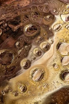 Dense brown bubble pattern in liquid macro abstract organic texture Stock Photos