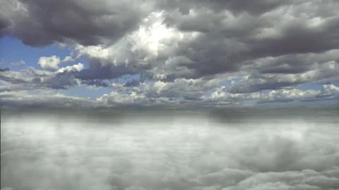 Dense Cloud Formations Rolling Beneath Clear Blue Sky Stock Footage 342073596