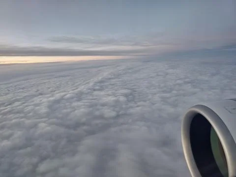 Dense cloud layer viewed from airplane window above Europe Stockfoto's