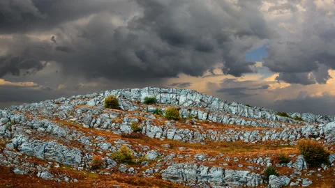 Dense clouds above a single mountain Stock Footage 152386678