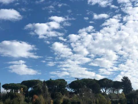 Dense clouds on beautiful blue sky Stock Photos
