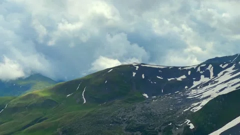 Dense clouds build above the Caucasus ridges near Abudelauri Stock Footage 340388967