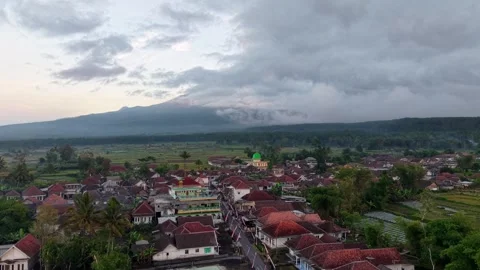 Dense clouds loom over distant mountains Stock Footage 346252125