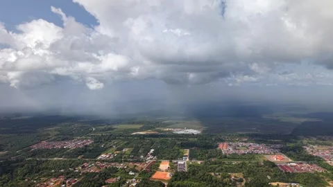 Dense clouds loom over green countryside Stock-Footage 332599279