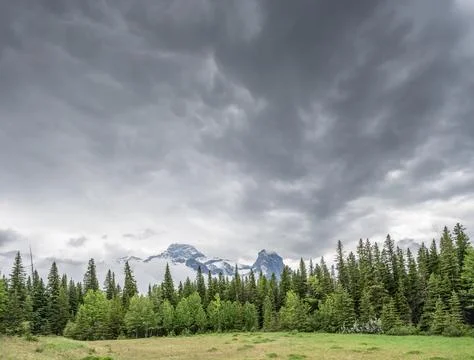 Dense Clouds over Mount Lougheed and Wind Tower Stock Photos