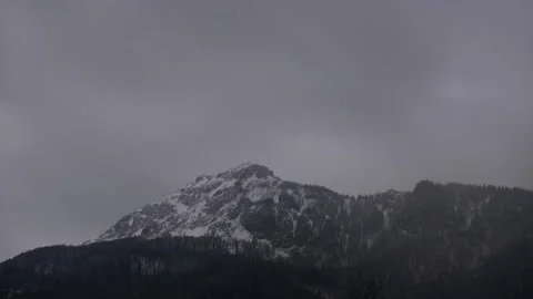 Dense clouds over the rocky peak. Windy winter weather. Clouds and fog Stock-Footage 152444648