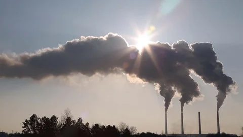 Dense clouds of smoke or vapor out of the three factory chimneys on background Stock Footage 72013085