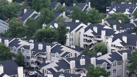 Dense cluster of dark gray-roofed condominiums fills townhome complex in Union Stock Footage 342316343