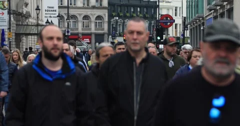 Dense crowd of people walking down a central London street Stock Footage 321033410