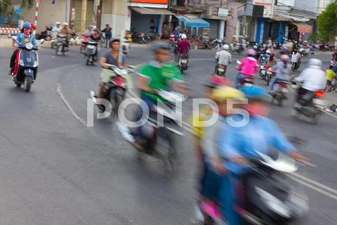 Dense, Crowed Scene Of City Traffic In Rush Hour, Crowd Of People Wear Helmet