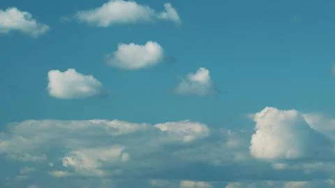 Dense Cumulus Clouds On A Clear Blue Sky. White Clouds In Blue Sky. Picturesque Stock Photos