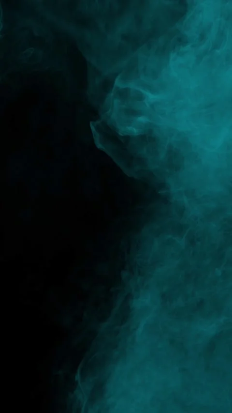Dense cyan arctic smoke on black background, vertical format Stock Footage 340146064