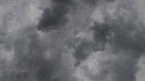 Dense dark clouds dominate the sky Stock Footage 335304865