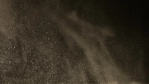 Dense dust particles fly in the air in slow motion on a black background mac Stock Footage 280299474