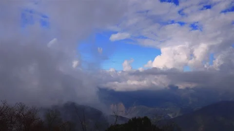 Dense ever-changing fluffy cloudscape on the mountain top. Stock Footage 277952818