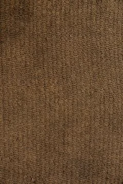 Dense floor rug with granular texture of orange color Stock Photos