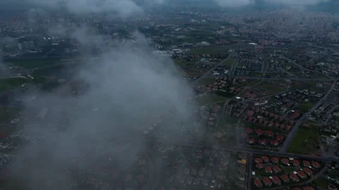 Dense Fog and Clouds Passing Over Residential Area Stockbeeldmateriaal 333375151