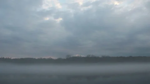 Dense fog and dramatic sky over river and forest (FULL HD) Video stock 37013648