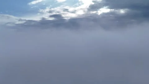 Dense Fog and Low Clouds Creating an Atmospheric Gray Landscape Stock Footage 343767893