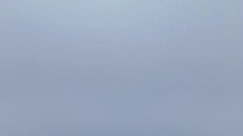 Dense Fog and Low Clouds Creating an Atmospheric Gray Landscape Vídeos de archivo 343768097