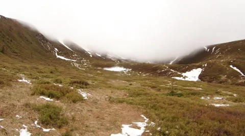 Dense Fog Over the Withered Grass and a Small Amount of Snow on the Stock Footage 63961210