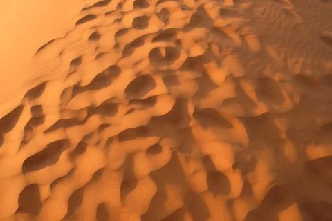 Dense footprints pattern in brown golden Sahara Desert at sunset Stock Photos