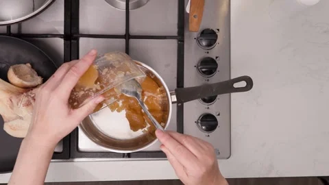 Dense, gelatinous bone broth with collagen, texture tested in a cool kitchen Stock Footage 344032071